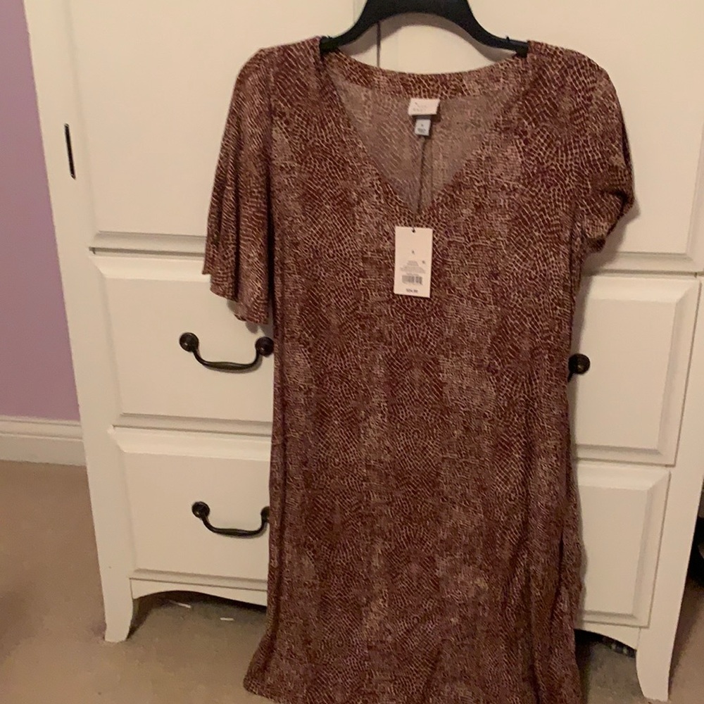 Snake Skin Dress that has a belt attached to it